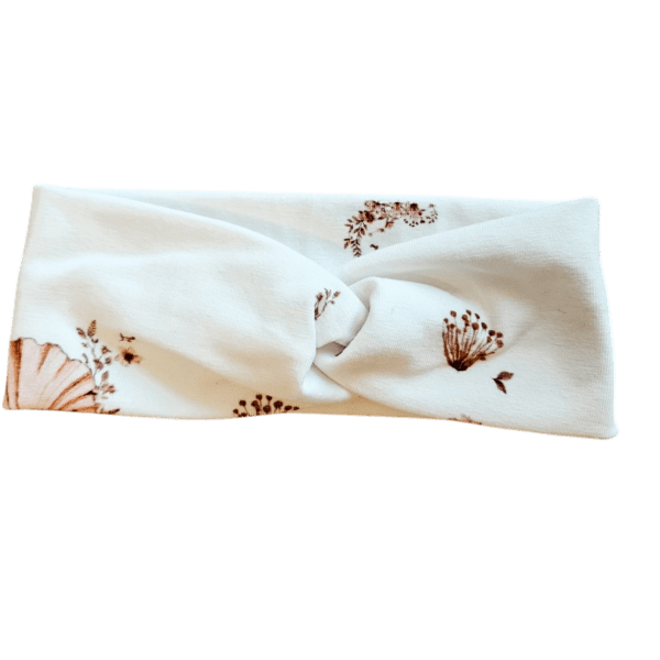 Witte haarband met gedraaid knoopdetail en bruine bloemenprint voor baby's en peuters